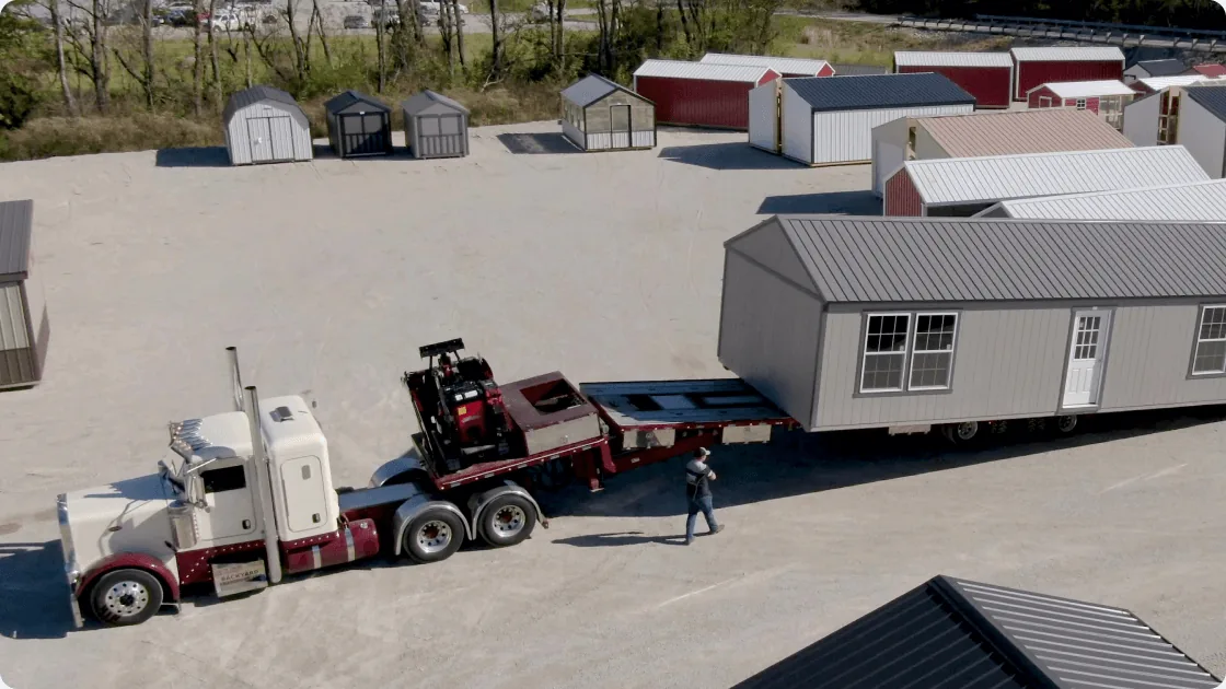 A finished shed being delivered from The Backyard & Beyond lot