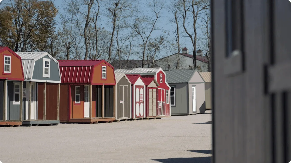 A row of finished sheds on The Backyard & Beyond sales lot
