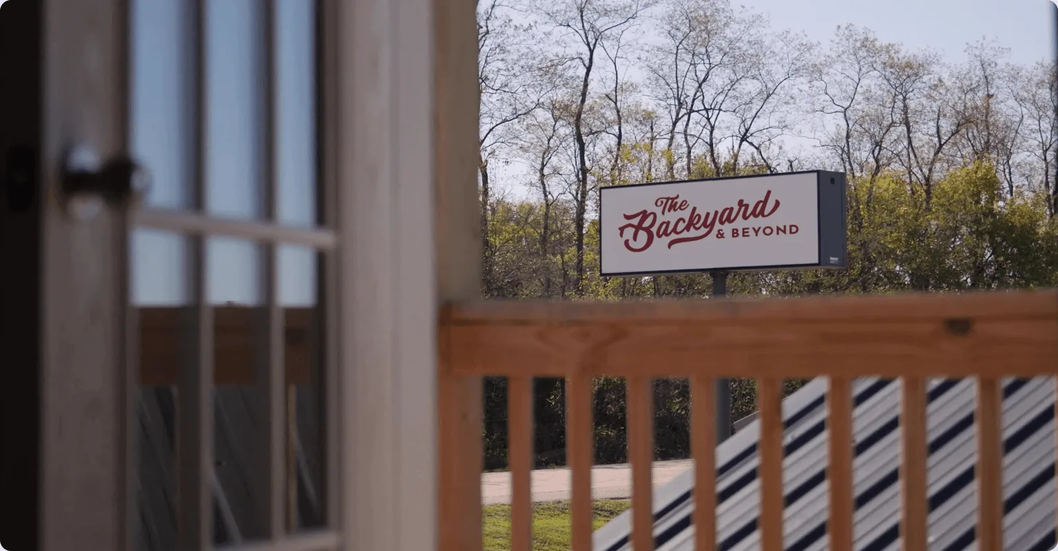The Backyard & Beyond sign at their sales lot